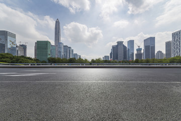 Obraz premium Panoramic skyline and modern business office buildings with empty road,empty concrete square floor