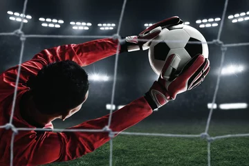 Keuken foto achterwand Voetbal Soccer goalkeeper catches the ball