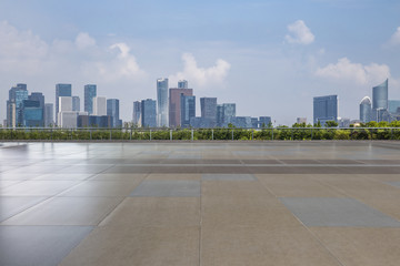 Panoramic skyline and modern business office buildings with empty road,empty concrete square floor