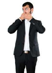 Fototapeta premium Handsome businessman covering his mouth