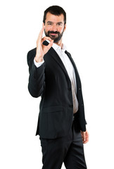 Fototapeta premium Handsome businessman making OK sign