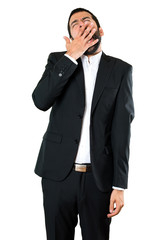Handsome businessman yawning