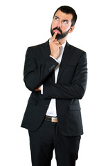 Fototapeta premium Handsome businessman having doubts