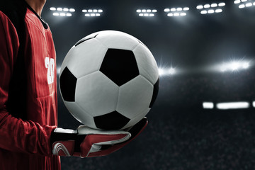 Soccer goalkeeper holding soccer ball