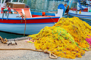 Fishing nets and boat in harbor, Crete, Greece