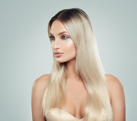 Naklejka premium Beautiful Woman with Fresh Skin and Healthy Blonde Hair. Facial treatment. Cosmetology, beauty, haircare and spa