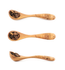 Spoon of coffee beans isolated