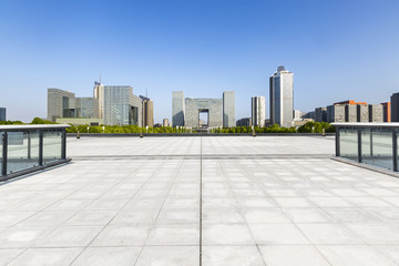 Panoramic skyline and modern business office buildings with empty road,empty concrete square floor