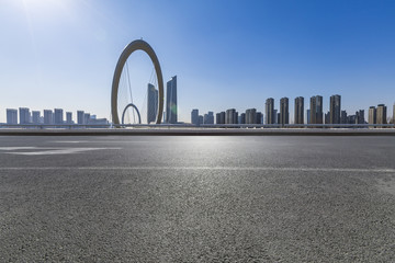 Panoramic skyline and modern business office buildings with empty road,empty concrete square floor