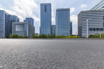 Panoramic skyline and modern business office buildings with empty road,empty concrete square floor