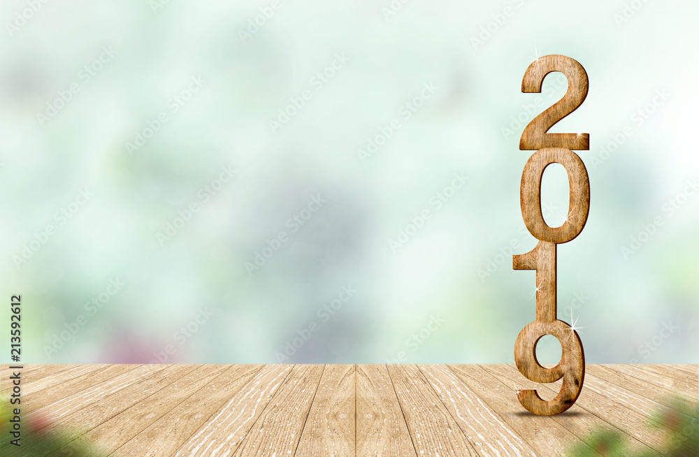 Aufkleber new year 2019 wood number (3d rendering) on wooden plank table at blur abstract green bokeh backgrou