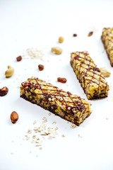Granola bar. healthy sweet dessert snack. ?ereal granola bar with nuts, fruit and berries on white table. top view.