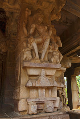Carved figures of the god on the decorated sober and square pillars of the entrance porch of Durga temple, Aihole, Bagalkot, Karnataka. The Galaganatha Group of temples.