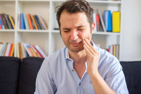 Man With Gum Disease Feeling Pain And Sick