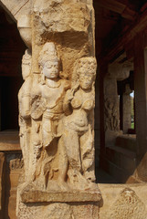 Carved figures on the sober and square pillars of the entrance porch of Durga temple, Aihole,...