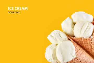 ice cream balls with colored sugar sprinkles in a Waffle Cone on a yellow Background. Vanilla ice cream in a waffle cone.