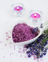 Heart-shaped bowl with sea salt  and fresh lavender flowers