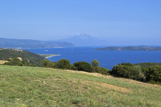 Beautiful summer sea landscape with a view on Ammouliani island and Mount Athos. Halkidiki, Greece.