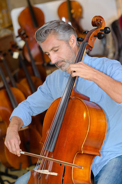 man playing cello