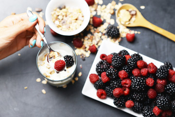 Preparing a healthy granola for breakfast with healthy ingredients

