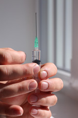 Doctor hold full syringe for injection medicine or vaccine.
