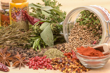 Various spices on wooden background.