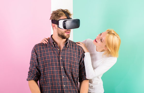 Man VR Glasses Enjoy Video Game. Girl Happy He Like Her Gift. Gift Ideas For Men. Make Him Happy Gift Him Virtual Reality Glasses And Let Play Games All Day. Best Gift Ever. Man Enjoy Virtual Reality