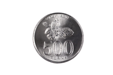 An extreme close up of an Indonesian 500 rupiah coin on a solid white background