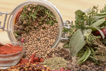 Various spices on wooden background.
