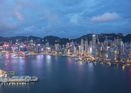 Aerial view of Victoria Harbor of Hong Kong City at dusk