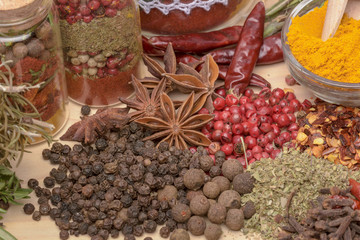 Various spices on wooden background.