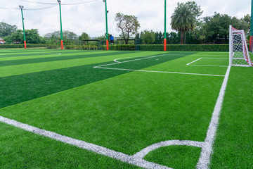 Green artificial grass field,soccer line.
