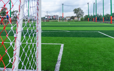 Green artificial grass field,soccer line.