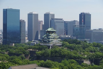 Osaka Castle with business district of Osaka in Japan　大阪城　ビル街を背景に