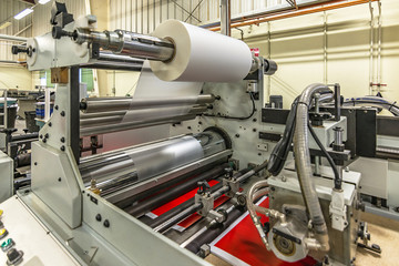Matte or gloss plastic machine in a printing press for a perfect finish of printed documents.