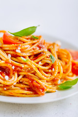 Pasta dish with tomato sauce on white plate