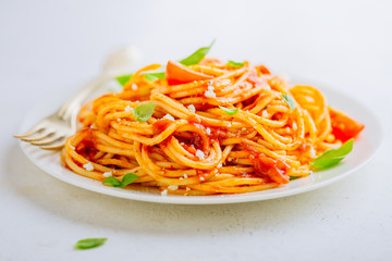 Pasta dish with tomato sauce on white plate