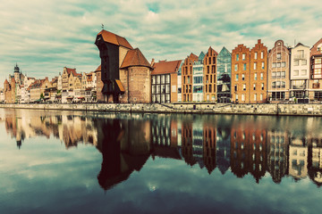 Old buildings and Zuraw crane near Motlawa river in Gdansk