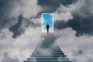 win concept with businessman and stairs to sky