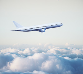 Fototapeta na wymiar airplane above clouds
