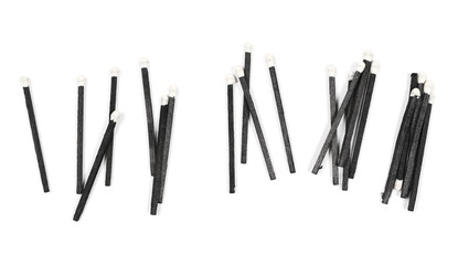 Black matches isolated on white background, top view