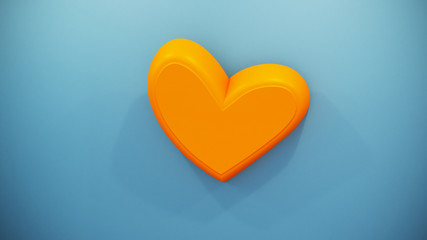 Plastic orange heart symbol on the blue wall.
