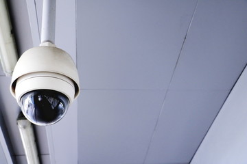 CCTV security camera operating in home. Image of CCTV security camera on background. CCTV ball on safe ground. 