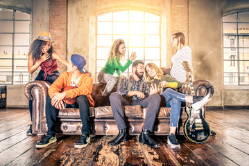 Friends having fun on the sofa at home