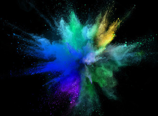 Colored powder explosion on black background.