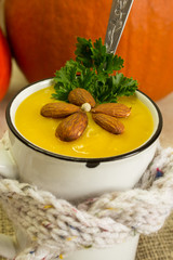 Pumpkin soup. Cream of pumpkin soup with parsley and almonds. A traditional autumn dish.