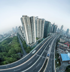 Fototapeta na wymiar aerial view of buildings and highway of shanghai city in smoggy dawn