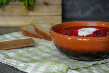 Delicious homemade borsch with sour cream.