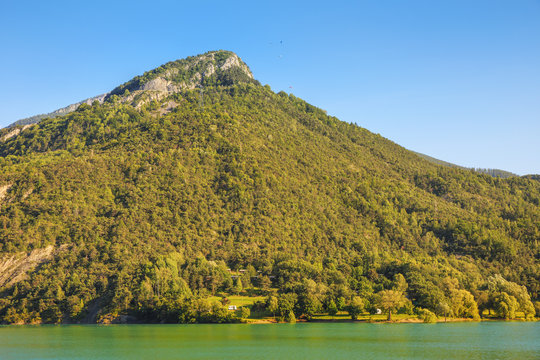 
Paragliders train on the lake Serre-Poncon. France.