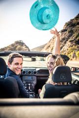 Couple on convertible car